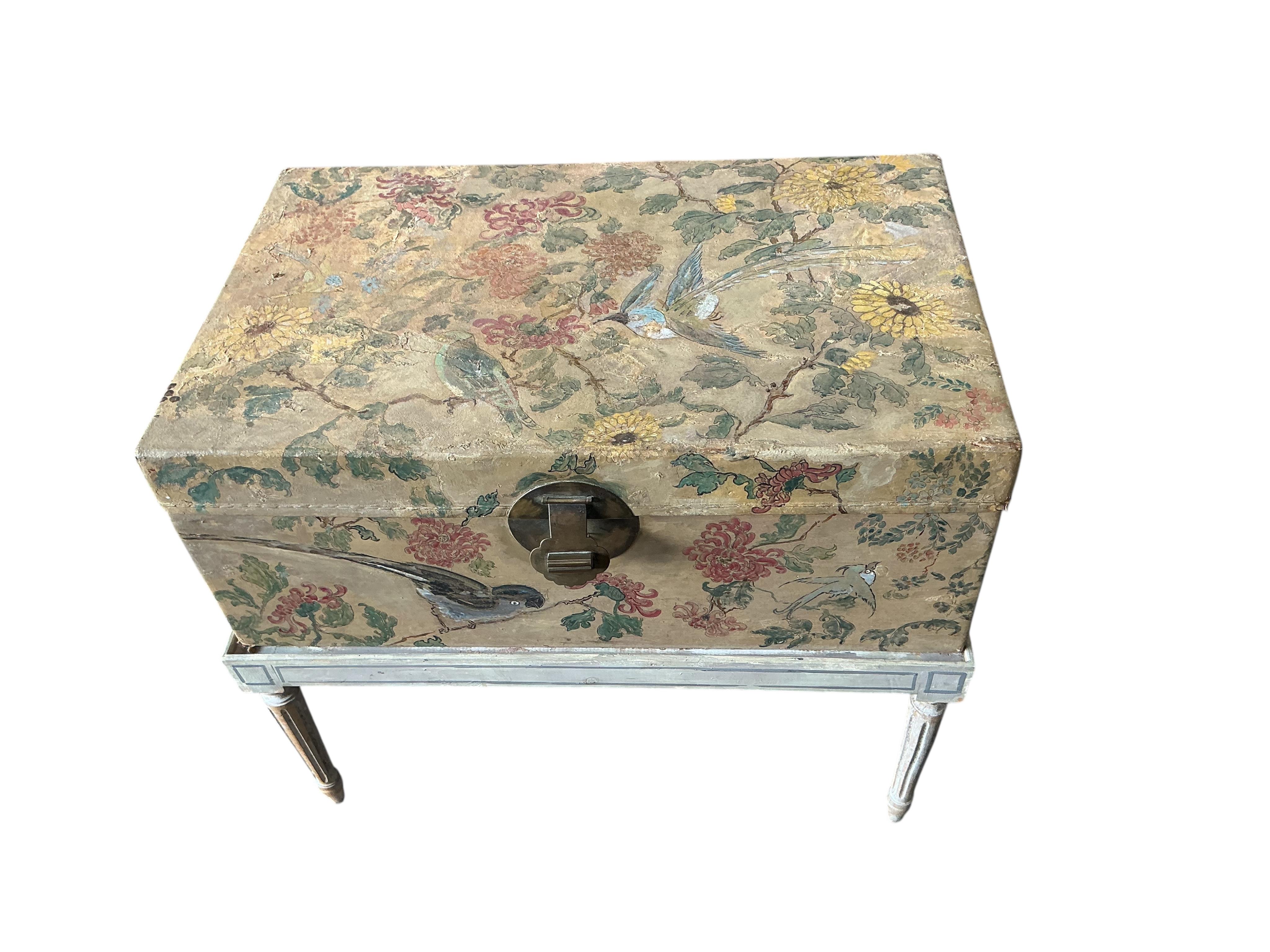 A Chinese painted hide chest on a cream painted parcel gilt stand, width 77cm, depth 50cm, height 67cm